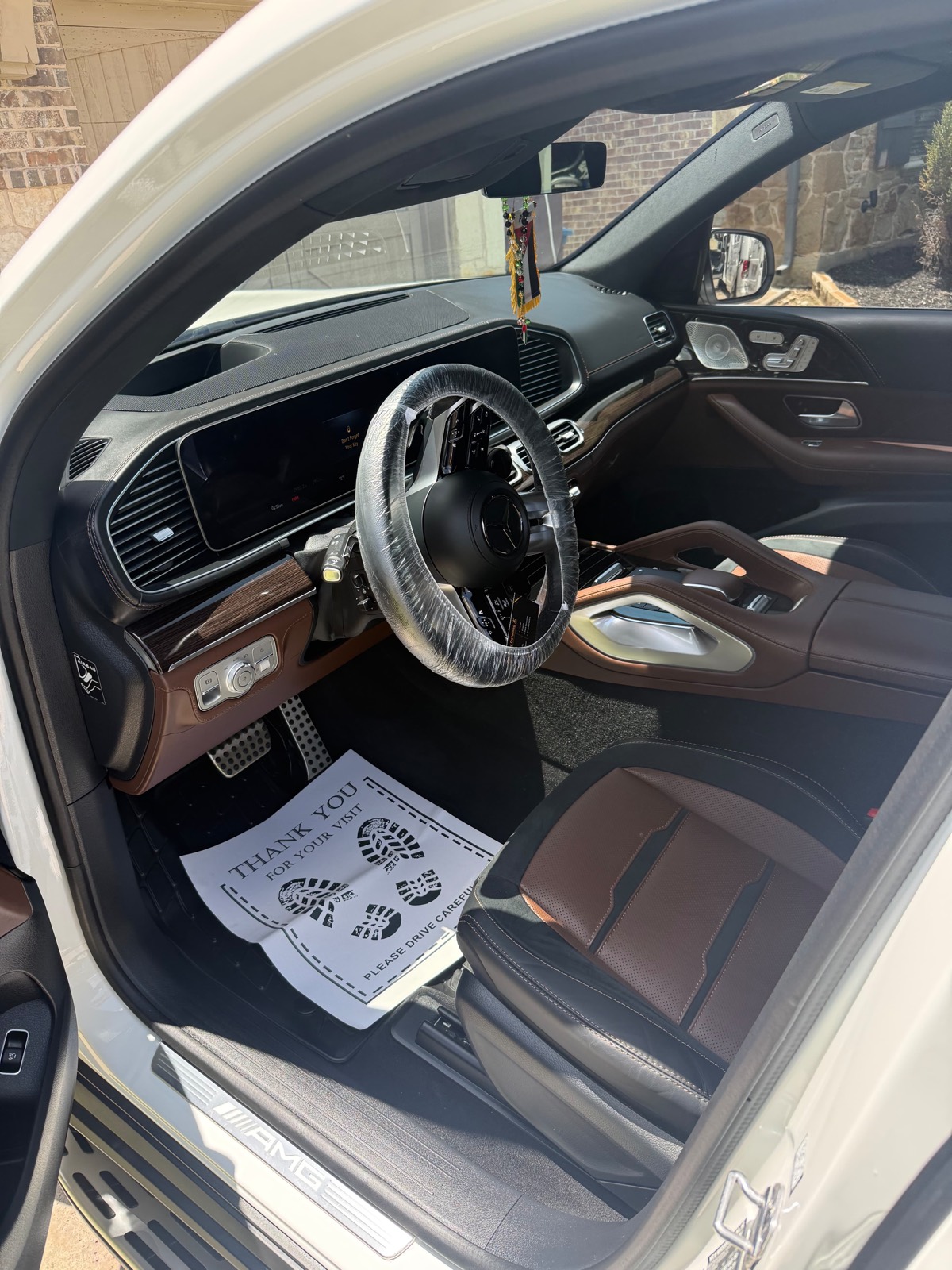 Mercedes-AMG interior detail with protective steering wheel cover — Frisco, TX